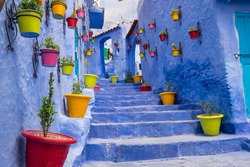 Africa,North Africa,Morocco, Chefchaouen or Chaouen  is most  noted for its small narrow streets and neighborhoods painted in vivid blue colors. Plantings in colorful pots line the narrow corridors.
