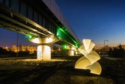 Light painting during sunset on the background of surface metro at the south of Moscow, Russia.