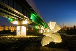 Light painting during sunset on the background of surface metro at the south of Moscow, Russia.