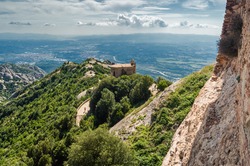 Sunny view of mountains of Santa Maria de Montserrat Abbey in Monistrol de Montserrat, Catalonia, Spain.