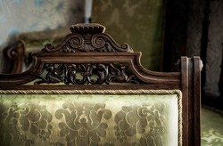 Details of vintage furniture. Wooden motives on a 18th century chair.