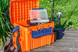 A large fisherman's tackle box fully stocked with lures and gear for fishing.fishing lures and accessories.Fishing tackle - fishing spinning. 