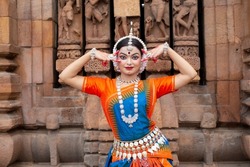 Beautiful Indian Odissi dance posing at Brahmesvara Temple in bhubaneswar, odisha, India. Odissi or Orissi dance is a major ancient Indian classical dance form originated in the Hindu temples.