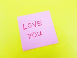 Egypt, Kafr El-Sheikh, 11-2-2023, Pink sticky note with text 'love you' on yellow background with copy space