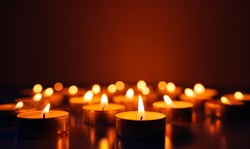 Kemerovo, Russia, fire in the mall, burning candles. Shallow depth of field. Many candles burning at night. Abstract candles background. Many candle flames glowing on dark background. Close-up. Free s