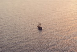 A lonely ship sailing in the open sea, as long as the eyes see only water. Beautiful marine Wallpaper