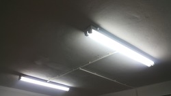 White light from Fluorescent light tube on the wall or Neon tube light.