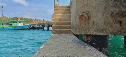 focus on the pier stairs. In my opinion, this pier was made specifically for the people of Sebesi Island. They live without adequate electricity and they live mostly as fishermen. This photo was taken