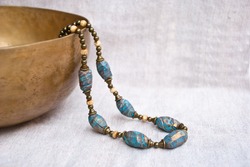 Bohemian beaded necklace from polymer clay. Handmade jewelry. Turquoise necklace in indian style. Oriental culture jewelry.