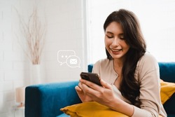 Young woman sending email by smartphone to customer, business contact and communication, email icon, email marketing concept, send e-mail or newsletter, online working internet network.