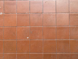 Clay Tile Flooring texture.  Clay tiles. Red stone clay quarry tiled floor detail. Aged tiles square clay orange floor. tiled floor with Terracotta tiles