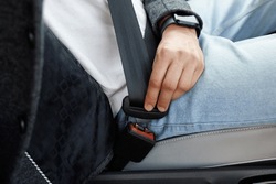 Man Hand Fastening Car Safety Seat Belt. Protection Road Safety Snap Driving. Driver Fastening Seatbelt In Car. Man Car Lap Buckling Seat Belt Inside In Vehicle Before Driving.