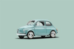 Model retro toy car on pastel blue background. Miniature car with copy space