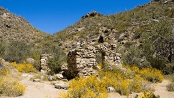 Remains of an Arizona abandoned stone cabin in Dove Mountain, near Tucson, Oro Valley, and Marana, in Pima County, USA, in spring of 2023.