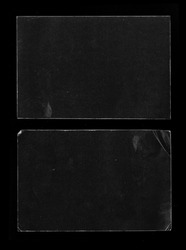Old Black Empty Aged Damaged Paper Cardboard Photo Card Isolated on Black. Real Halftone Scan. Folded Edges. Rough Grunge Shabby Scratched Torn Ripped Texture. Distressed Overlay Surface for Collage. 