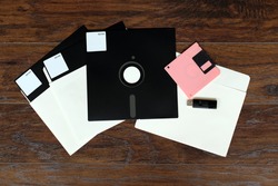 The old 8-inch floppy disk, for an old computer, a comparison with the flash drive