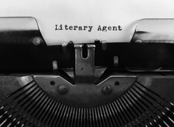 Literary Agent, occupation publishing title heading typewritten on vintage manual typewriter machine, monochrome black and white, blank space, author, writing and talent industry