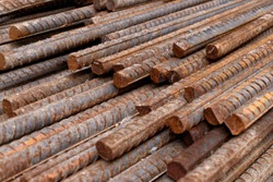 Stack of rusty iron rods or bars