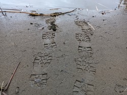 footprints in the sand.footprints in the sand. prints on the shore. shoe mark. footprints in the sand. shoe print 