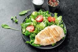 Grilled chicken breast and salad, Chicken meat with salad on a stone background. Healthy food.