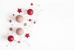 Christmas composition. Christmas red and golden decorations on white background. Flat lay, top view, copy space