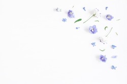 Flowers composition. Border made of lilac and white flowers. Flat lay, top view, copy space