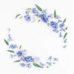 Flowers composition. Wreath made of blue flowers on white background. Flat lay, top view