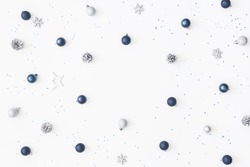 Christmas composition. Christmas balls, blue and silver decorations on white background. Flat lay, top view, copy space