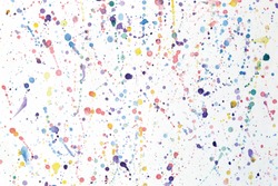 Splashes of paint on a sheet of paper background