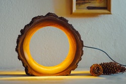 wood lamp handmade in front of a white wall