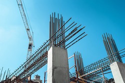 Steel Frames of A Building Under Construction, With Tower Crane On Top