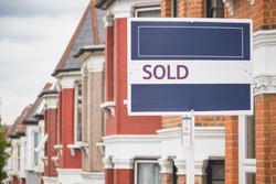 Sold sign displayed outside a terraced house in Harringay Ladder, London