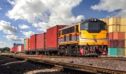 Container Freight Train with cloudy sky.