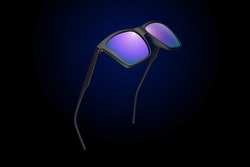 Sunglasses on a black gradient, matte background. The concept is stylish and beautiful. Studio shooting.