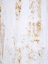 Rusted and corroded surface with chipped white paint background