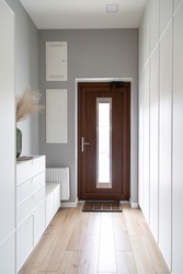 Close-up of a wooden door in the hallway in the style of minimalism.