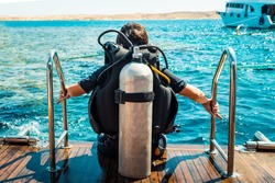 Scuba diver before diving. A diving lesson in open water.