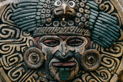 Traditional national indian totem.  Totem pole sculpture art. Ancient wooden mask.  Mayan and aztecs symbolic religious gods faces.  Ethnic pagan worship and idolatry.