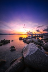rocks on beach with sunset sky backgrounds.English bay Vancouver Canada