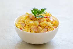 Nutritious salad with instant noodles, eggs, ham and red onion.