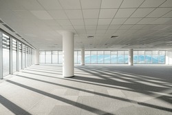 An empty workspace for the office. Huge panoramic windows with mountain views.