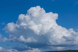 Midsummer cumulonimbus cloud in the blue sky