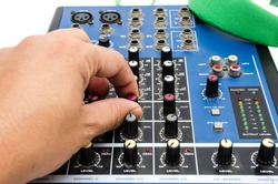 Hand and sound mixing console. Element of design.
