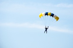 gestures of skydiving parachute extreme sport adventure fly on blue sky