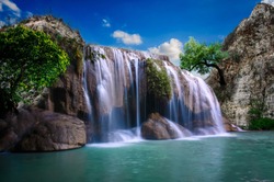 Erawan waterfall that is swaying on the day with beautiful bright sky.