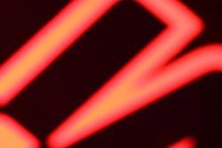 red neon color blurry letter image