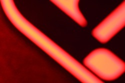 red neon color blurry letter image
