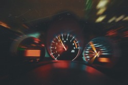 Sports Car Drives Fast at Night, Shows Interior of Car Including Speedometer and Tachometer