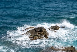 waves splashes on rock in sea shore, pretty calm sea