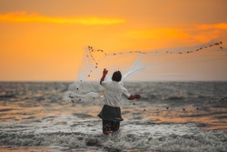  Fisherman throws his net. Arabian Sea.India.